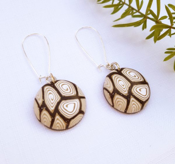 brown and white earrings